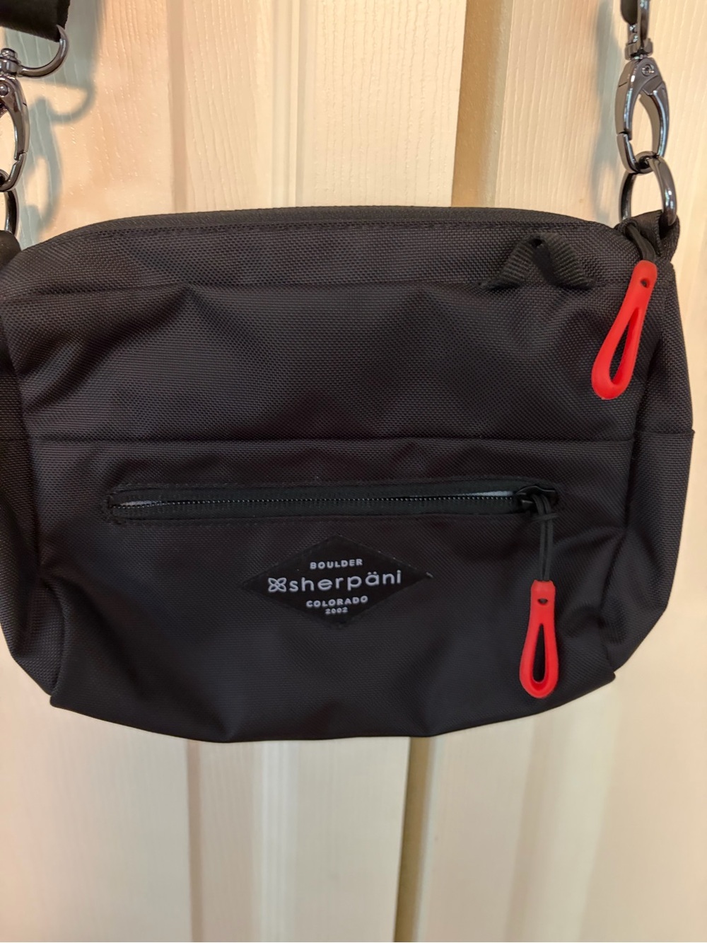 Sherpani Skye Mini Crossbody Black Bag with Red Zipper Pulls